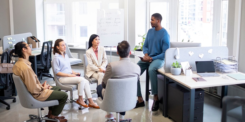 Team meeting focused on planning a strategic and empathetic downsizing process