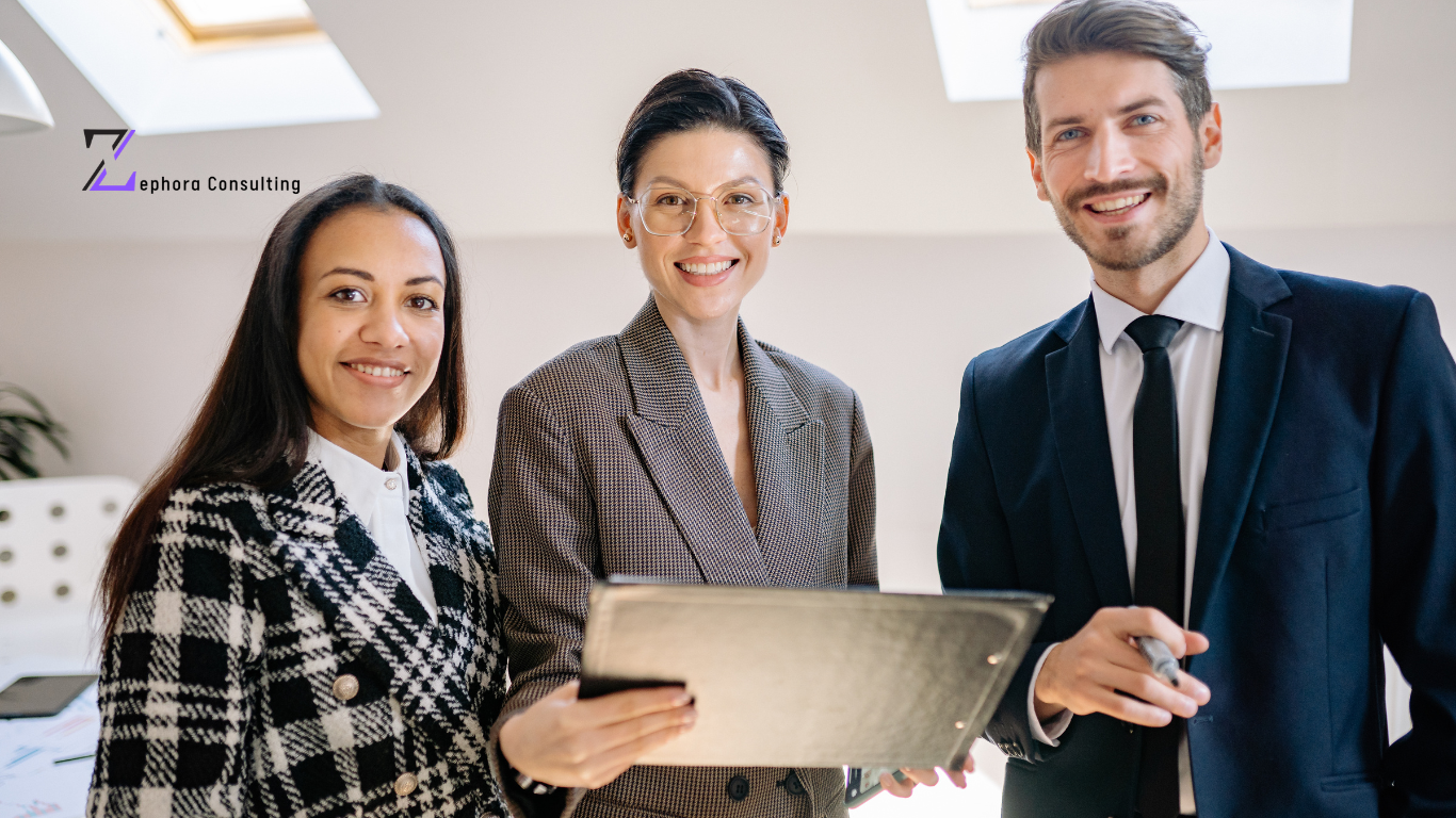 Group of diverse employees standing together and smiling, representing strong employer brand perception in the UAE and a positive workplace culture.