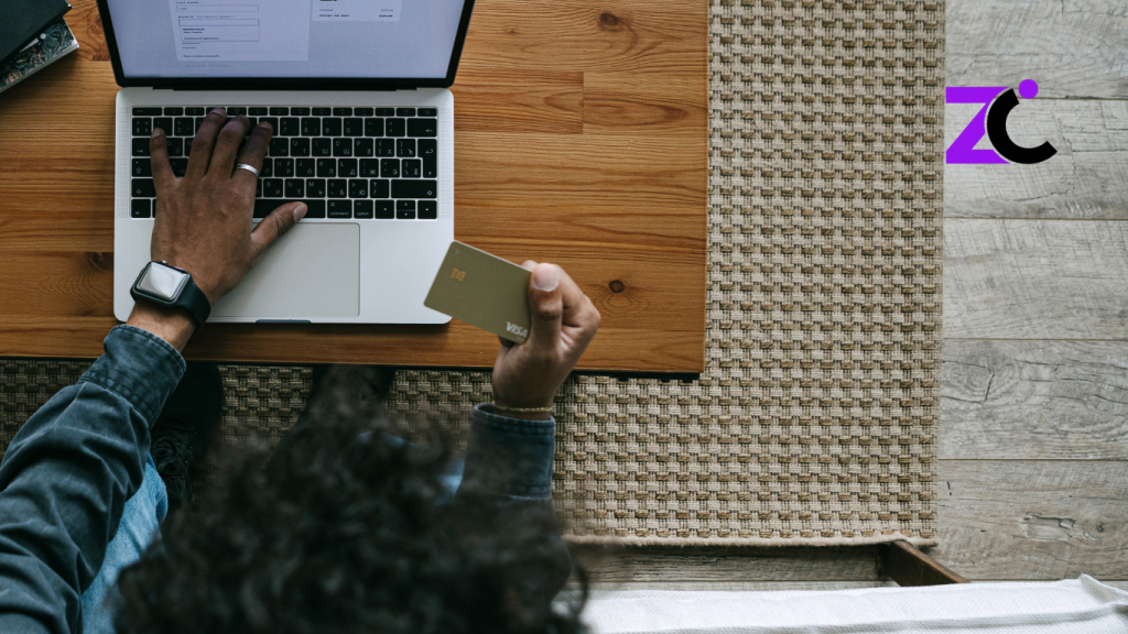 Woman shopping on an eCommerce website using a laptop and paying with a credit card, illustrating online shopping in the UAE.
