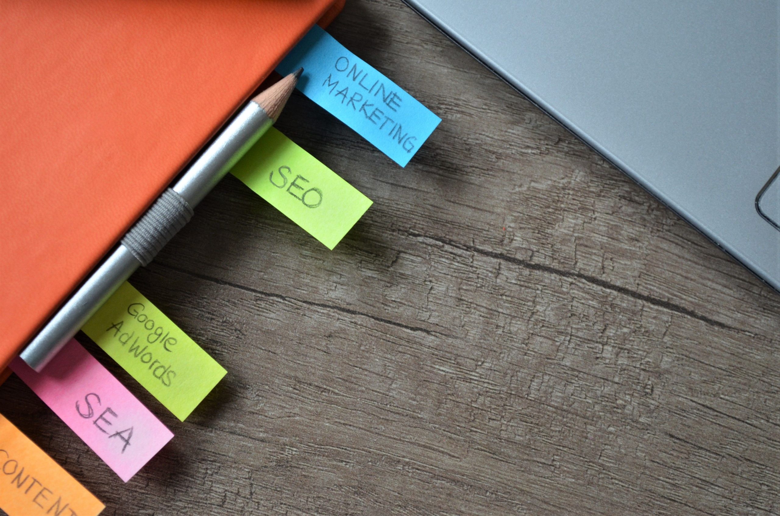 Book with bookmarks labeled SEO and online marketing representing content marketing strategies.