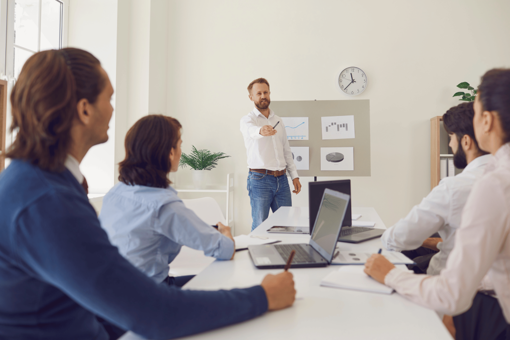 Executive coaching in UAE with a group of executives attending a leadership training session led by a professional coach.