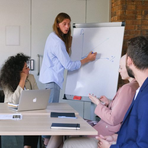 A women coach briefing about Change Management as a part of Organizational Consulting Services